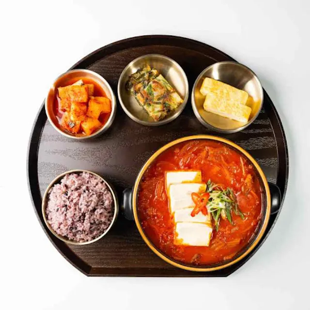 Pork Kimchi Jjigae with rice and banchan at Queens Bapsang