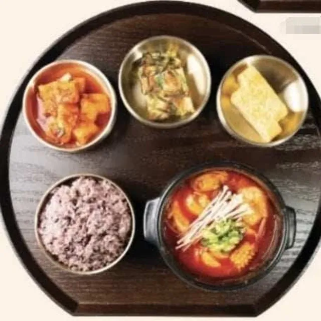 Seafood Sundubu Jjigae set with rice and side dishes